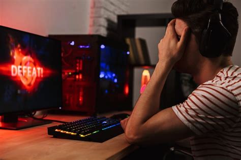 Premium Photo Side View Of Upset Gamer Playing Video Games On Computer