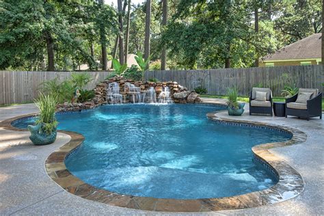 Peaceful Freeform Pool And Waterfall With Tanning Ledge By Morehead