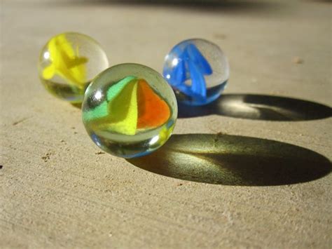 The balls vary in size. Creator's Joy: Images of Cat Eye Marbles