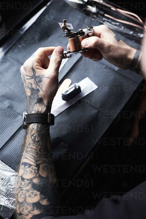 Tattoo Artist At Work In Studio Stock Photo