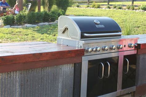 Two tempered glass shelves provide perfect platforms. DIY Outdoor Kitchens and Grilling Stations | The Garden Glove