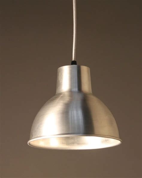 You may see individual pendant lights with enameled shades, or more commonly, aluminum bulb cages. Moccas Industrial Pendant Light | Fritz Fryer