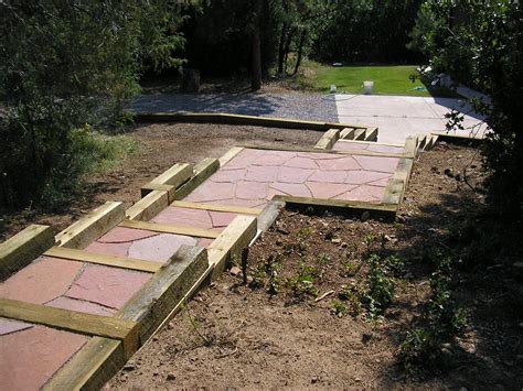Timber Retaining Wall With Rose Flagstone Walkway Designed By