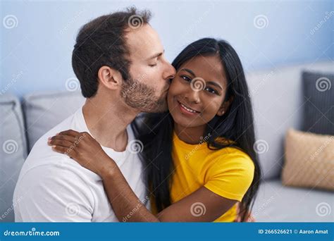 Man And Woman Interracial Couple Hugging Each Other And Kissing At Home Stock Image Image Of