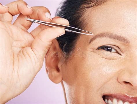 Eyebrows Grooming And Portrait Of A Woman With A Tweezers Isolated On