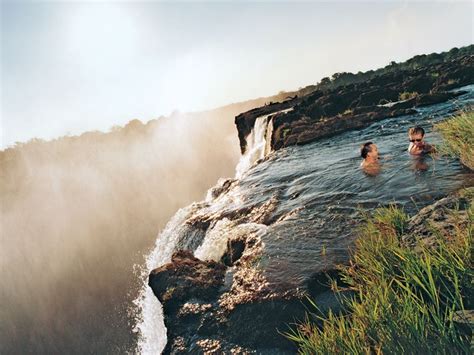 swimmers victoria falls livingstone island zambia by håkan ludwigson see more incredible