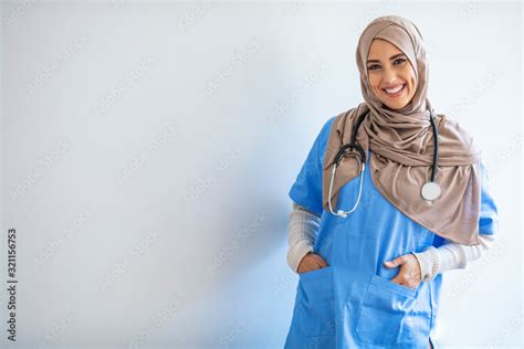 Cheerful Young Muslim Female Nurse Portrait Standing Inside Hospital