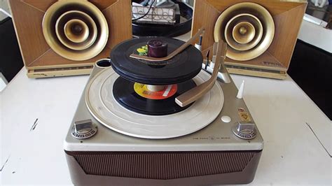 Motorola Calypso Record Player Playing A Stack Of 45 Rpm 7 Records