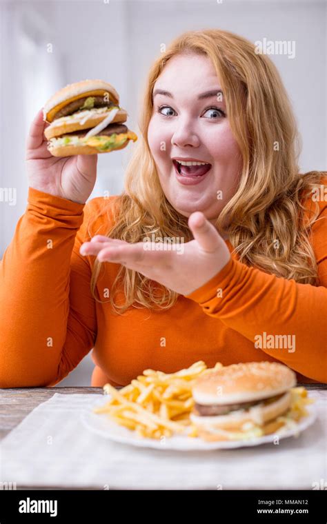 Alert Fat Woman Eating Fries And Sandwiches Stock Photo Alamy