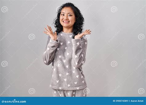 Young Asian Woman Wearing Pajama Celebrating Crazy And Amazed For