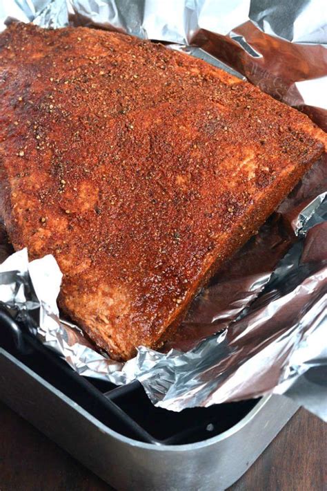 Low & slow oven brisket recipe. Cooking beef brisket in the oven in a roasting pan with ...