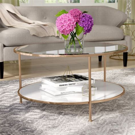 The coffee table comes with an extra feature, a mirrored bottom shelf to display your favorite decor correctly. Willa Arlo Interiors Jamiya Coffee Table & Reviews ...