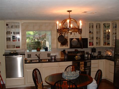 Strap the drain pipe under the sink so it's elevated above the tailpiece. Custom Cabinets | Lead Glass Cabinets | Raised Dishwasher