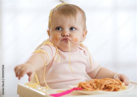 Adorable Little Baby One Year Old Eating Pasta Indoor Funny Toddler