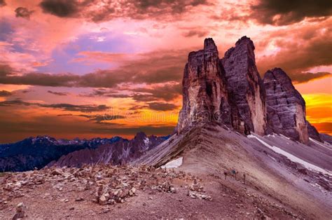 Panoramic View Of Tre Cime And Rifugio Hut Before Sunrise In Summer