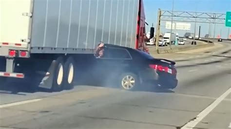 Semi Truck Drags Car Down On Illinois Highway