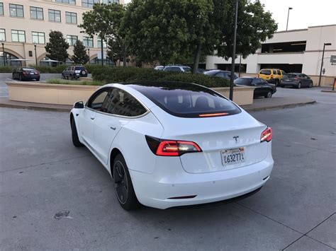Tesla Model 3 Supercharging Rear Teslarati