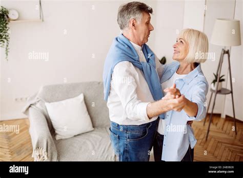 Happy Retirement Moments Senior Couple Dancing At Home Stock Photo Alamy