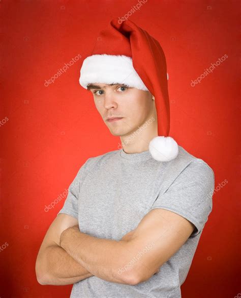 Young Man Wearing A Santa Hat — Stock Photo © Ishmel 1294637