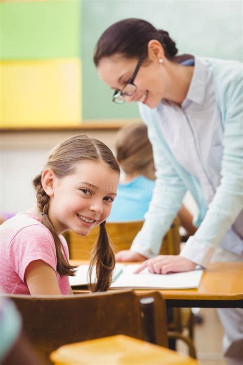 Teacher Helping A Pupil During Class Stock Image Image Of Early