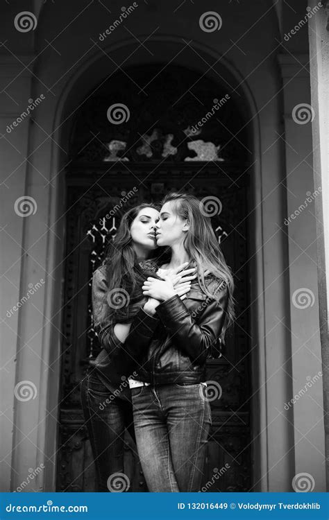pretty girls kissing and hugging in jeans on front door stock image image of outdoors