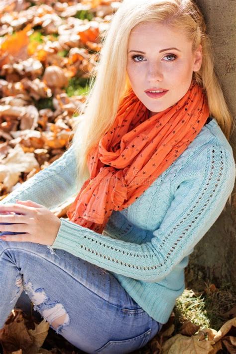 pretty girl is sitting in autumn park with maple stock image image of glamour background