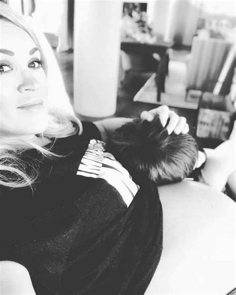 Pregnant Carrie Underwood Shows Off Bare Baby Bump With Son