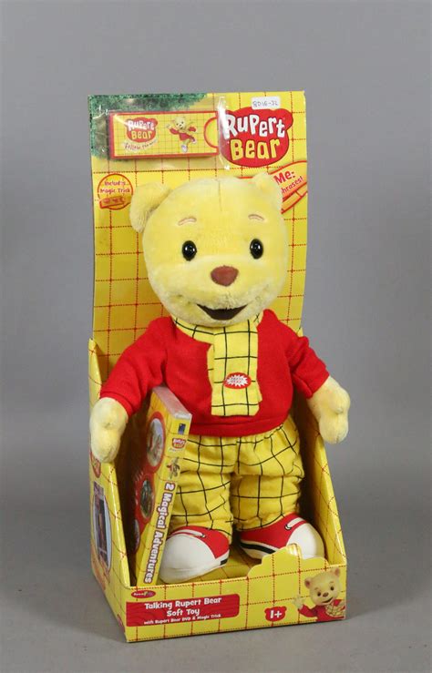A Boxed Talking Rupert Bear Soft Toy