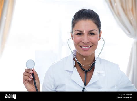Portrait Of Female Doctor Showing Stethoscope Stock Photo Alamy