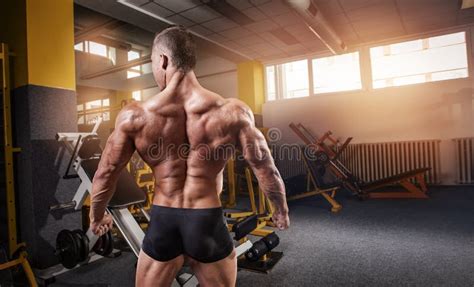 Strong Athletic Man Fitness Model Torso Showing Back Muscles Stock