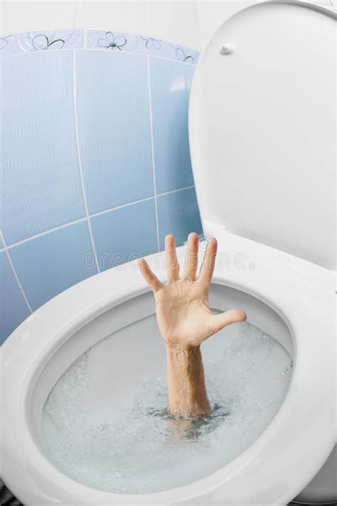 Human Hand In Toilet Bowl Or Wc Flushing And Asking For Help Stock