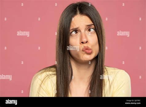 Cute Young Girl With Foxy Long Straight Hair Making Funny Face Over Pink Background Copy Space