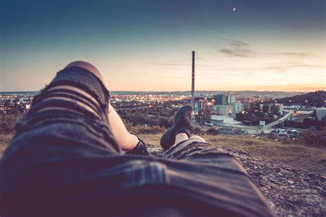 Young Man Chilling And Enjoying Evening Cityscape View Free Stock Photo
