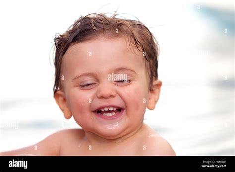 Funny Baby Cooling Off In The Pool Stock Photo Alamy