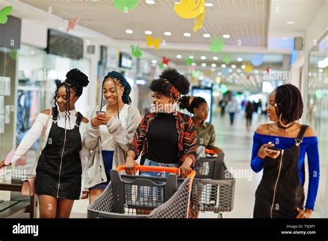 Group Of African Womans Walking With Shopping Carts On Mall Stock Photo Alamy