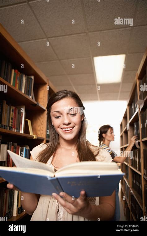 Two Female Students In Library Stock Photo Alamy