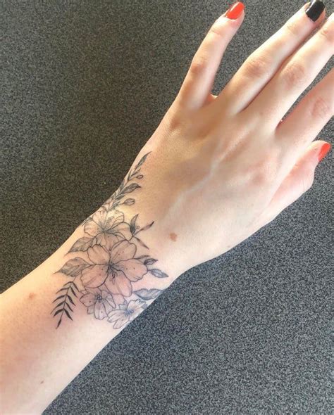 My Wrap Around Wrist Of Flowers Done By Laura Morkūnaitė At Ink Factory