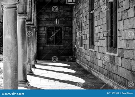 Courtyard Corridor In Black And White With Pillars And Stone And