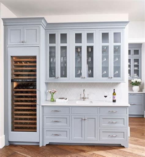 We're head over heels for this soft blue, modern kitchen. Chic butler's pantry features gray blue cabinets paired ...