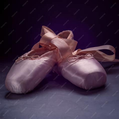 Premium Photo Pointe Shoes Ballet Dance Shoes With A Bow Of Ribbons Beautifully Folded On A