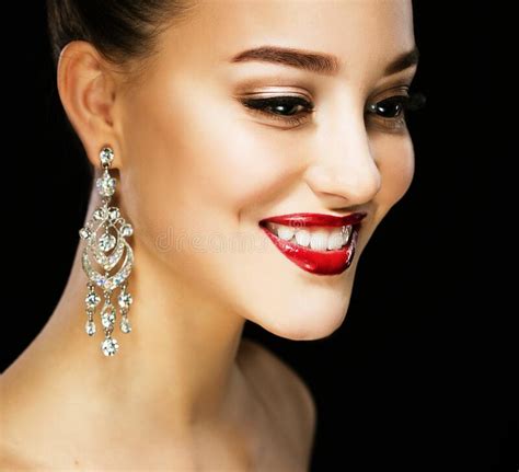 Beautiful Brunette Woman With Bright Make Up And Jewelry Earrings