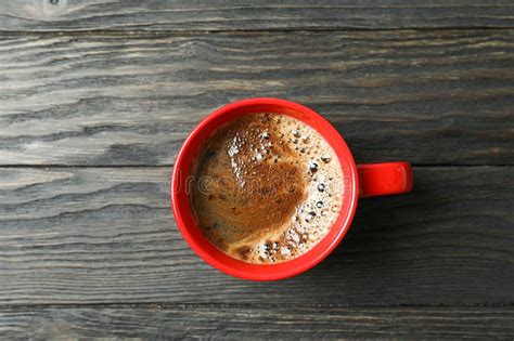 Cup Of Coffee With Frothy Foam On Wooden Background Space For Text And