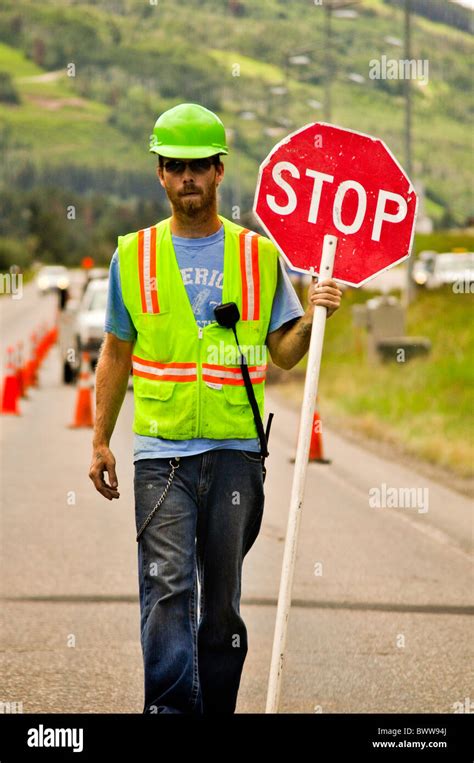 Road Worker Holding Stop Sign Stock Photo Alamy