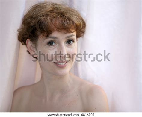 photo de stock happy mature topless woman by window 6816904 shutterstock