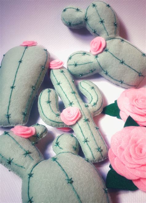 Minnie's iconic face drifts dreamily between two pink flowers and two fuchsia hair bows. Cactus baby mobile, cactus nursery decor, Cacti mobile ...