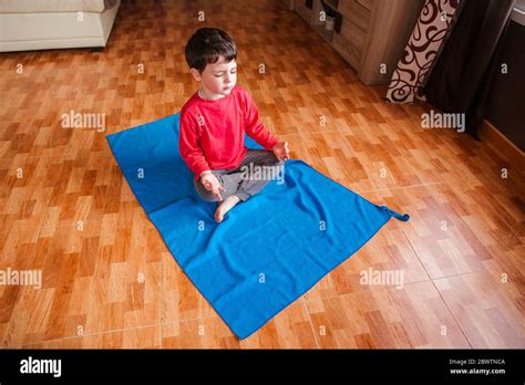 Little Boy Doing Yoga At Home Stock Photo Alamy