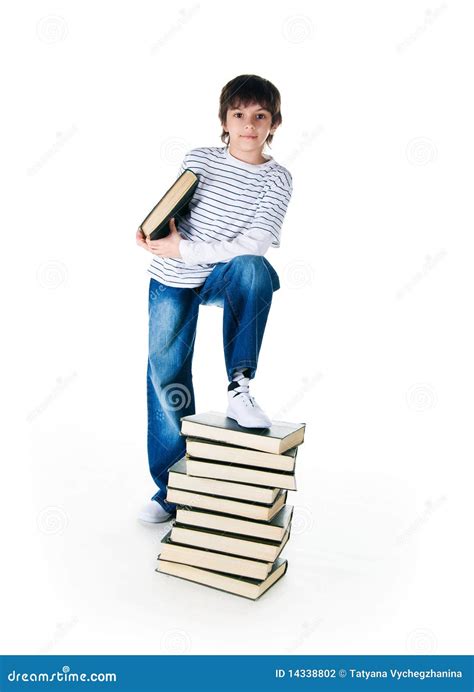 Cute Little Boy Near The Stack Of Big Books Stock Photo Image Of