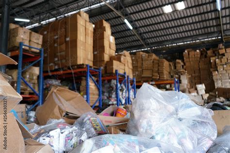 Blurry Image Of Poorly Organized Warehouse With A Lot Of Messy Stocks And Boxes Stock Photo