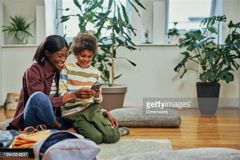 Son Showing Mom Phone Photos And Premium High Res Pictures Getty Images