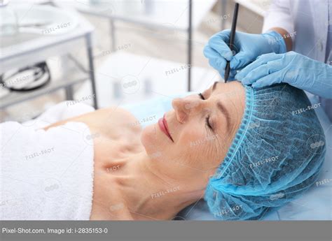 Surgeon Hand Drawing Marks On Female Face For Plastic Operation Stock Photography Agency